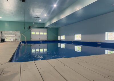 Indoor dog swimming pool with entry steps at Water Bark Wellness